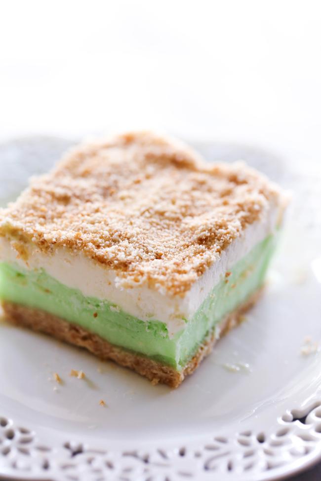 This Lime Sherbet Dessert is cool and refreshing. It has the most delicious soft cookie crust and is topped with sherbet and a homemade whipped topping. This dessert is perfect for a warm day!