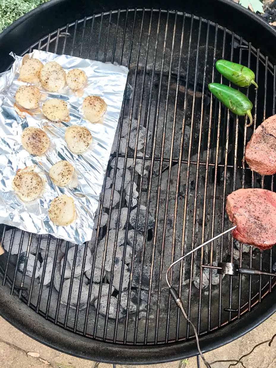 Scallops with steak and jalapeños on weber grill over direct heat