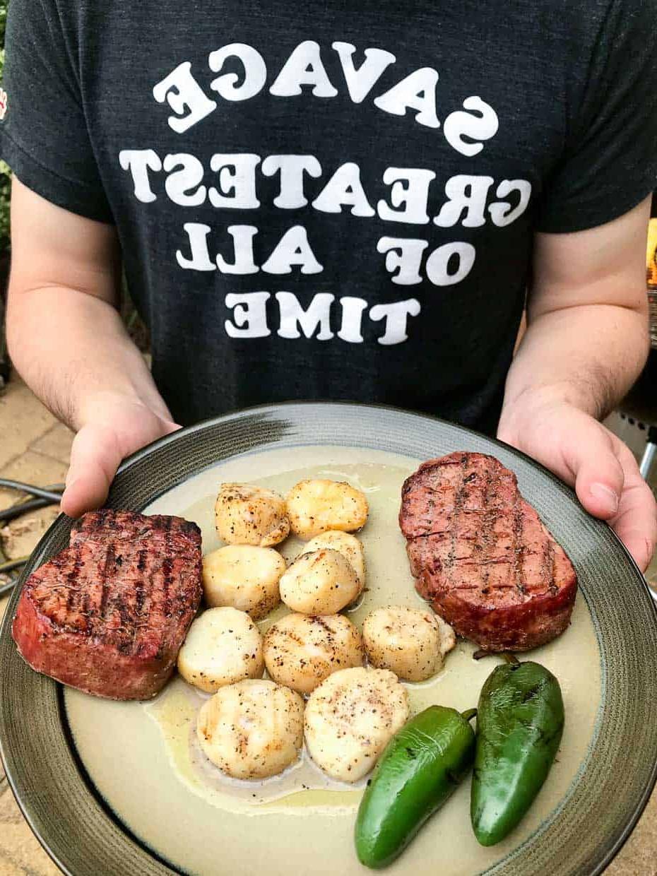 Smoked scallops with steak and jalapeños on plate ready to be served