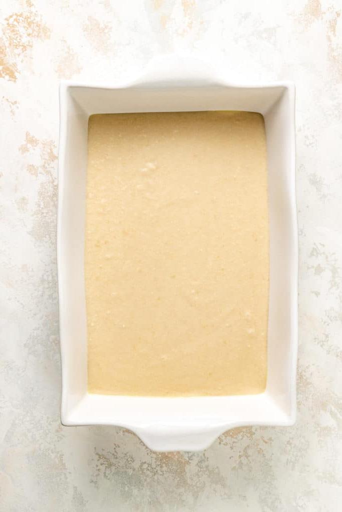 Cobbler batter in a baking dish.