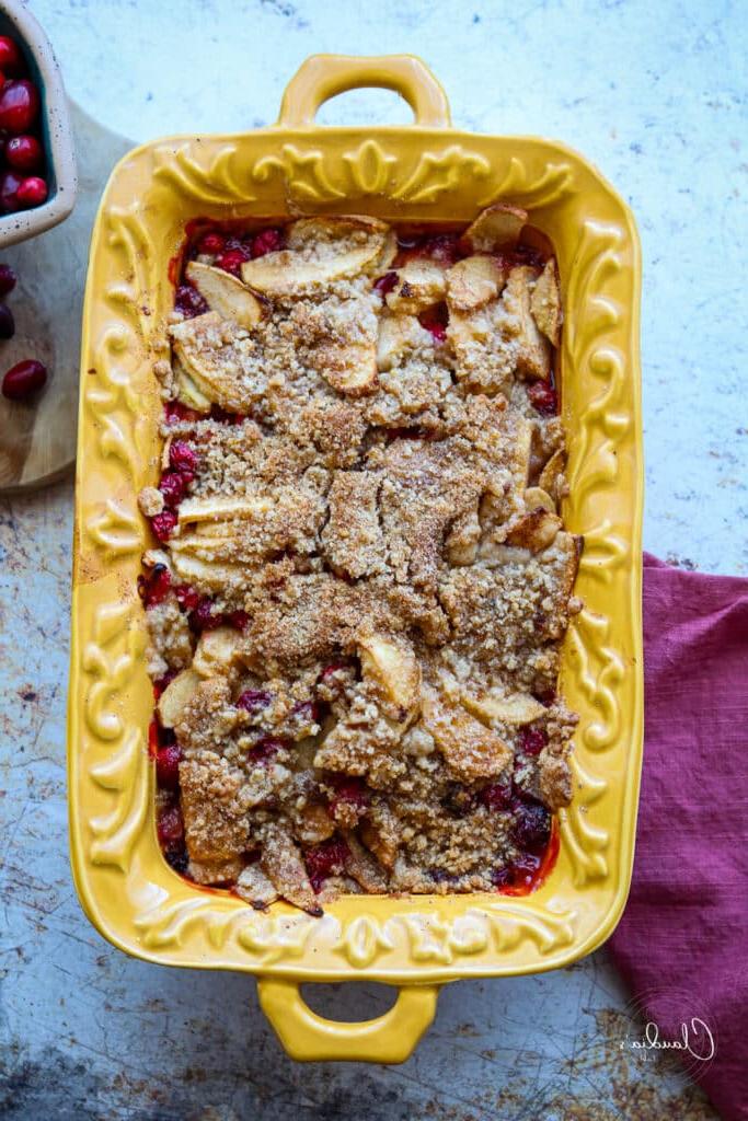 apple cranberry crumble in yellow baking dish