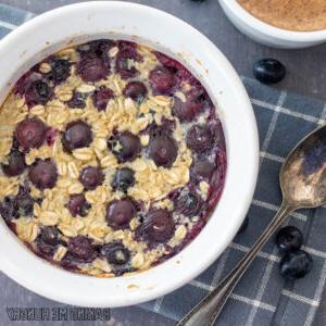 baked oats for one in a bowl with blueberries