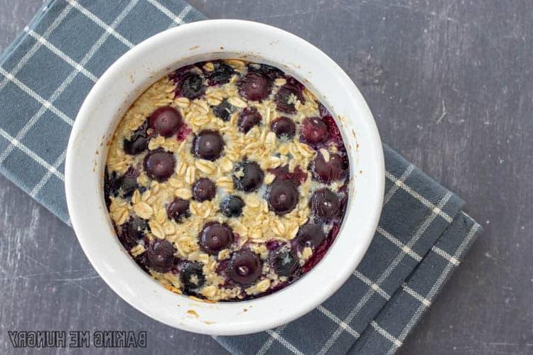 bowl of single serve baked oats with blueberries
