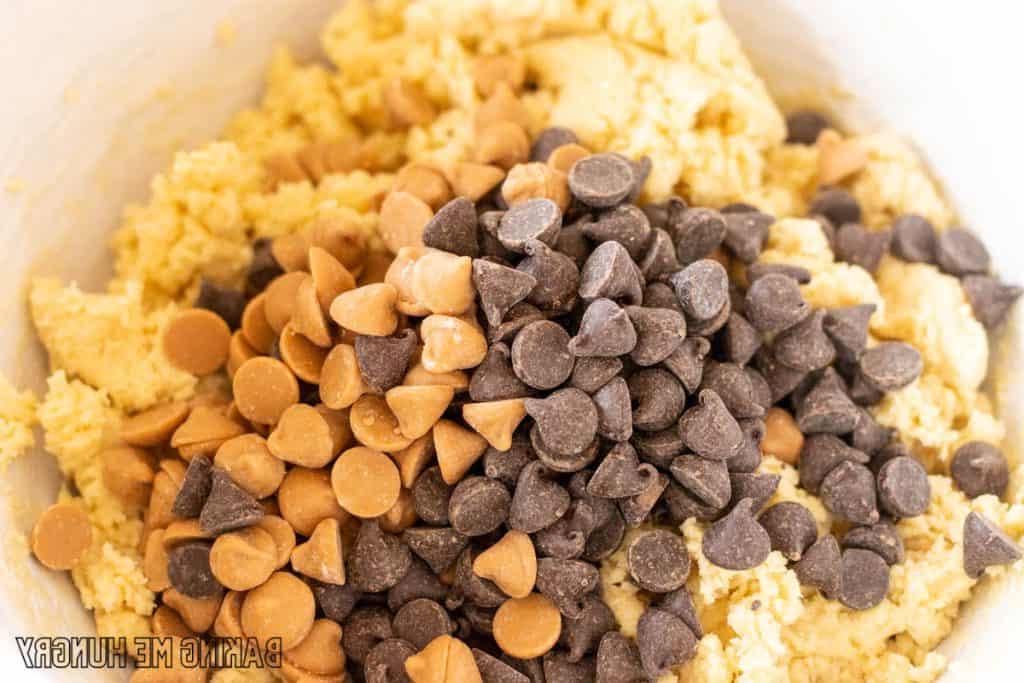 chocolate chips and butterscotch chips added to bowl