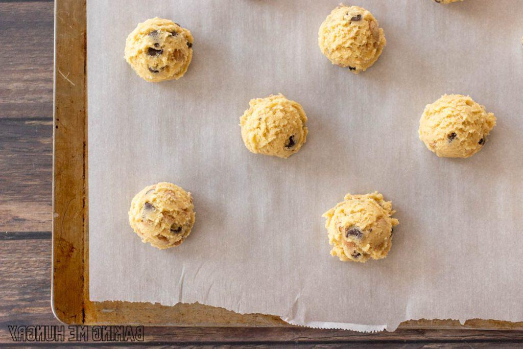 balls of dough on parchment lined tray