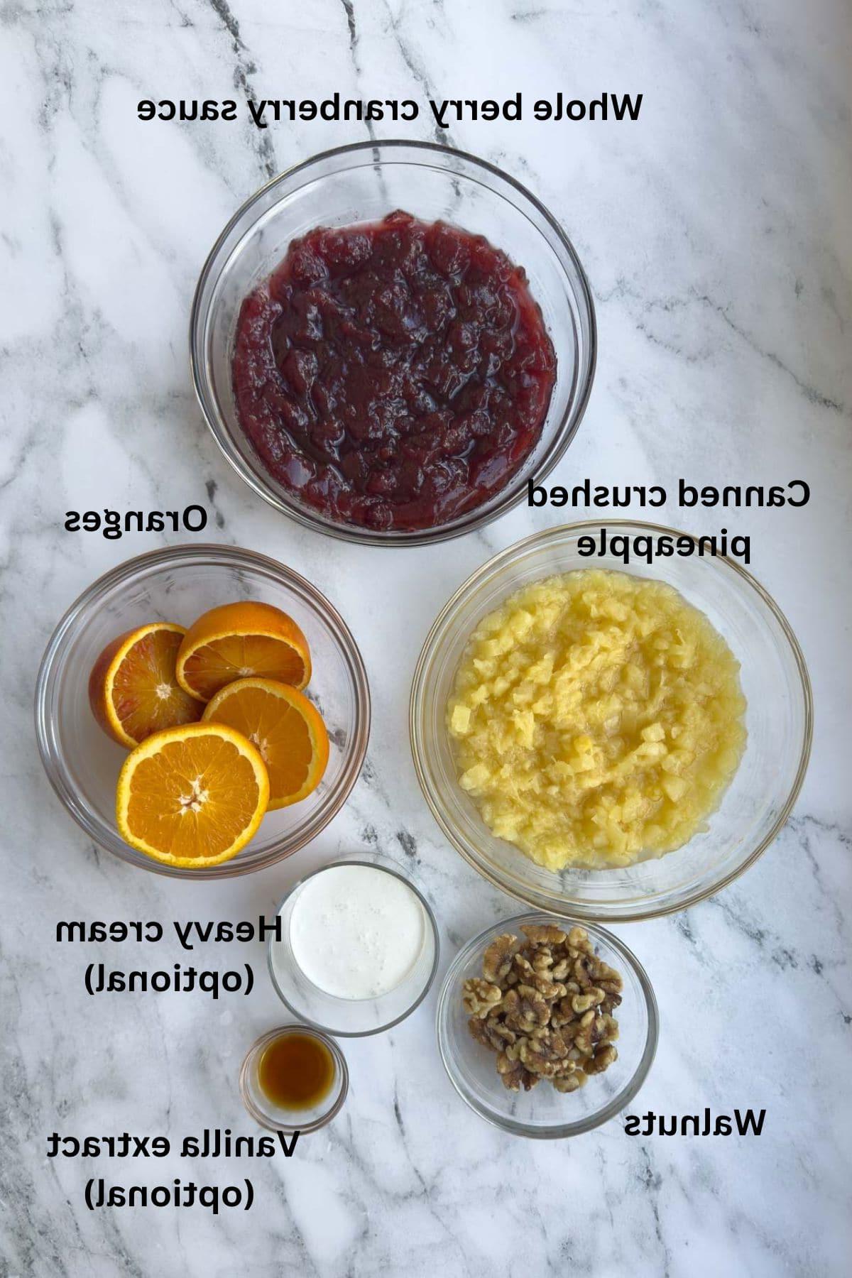 Ingredients for cranberry salad with pineapple and oranges.
